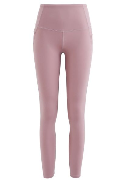Legging com bolsos de malha e cintura alta com detalhe de costura até o tornozelo em rosa empoeirado