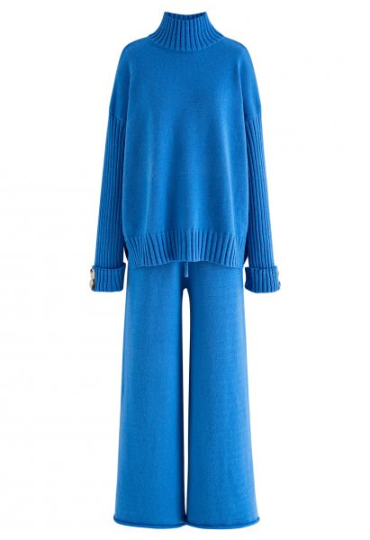 Conjunto de blusa de gola alta abotoada e calça de malha azul
