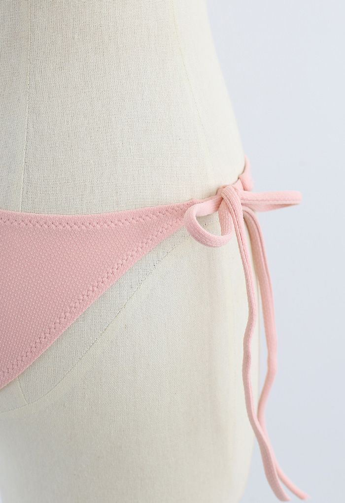 Conjunto de biquíni cintura baixa de um ombro e laço na cor rosa