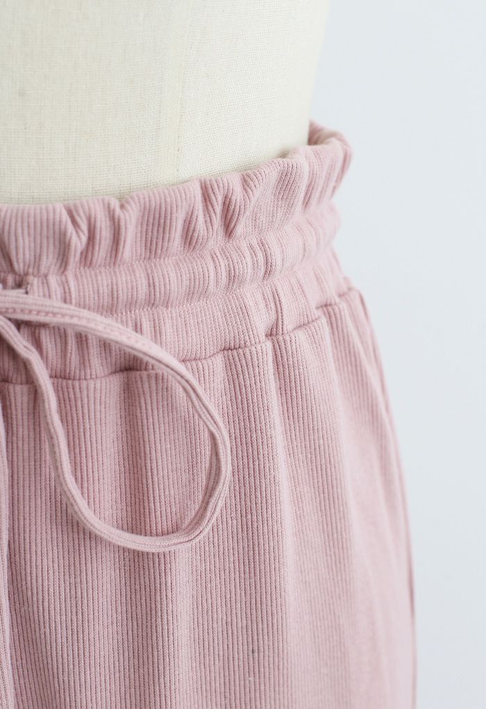 Calças de ioga com nervuras de cintura com cordão e saco de papel em rosa