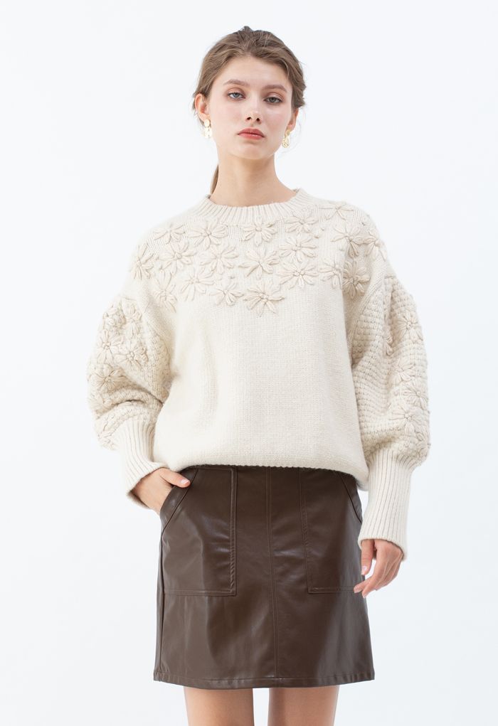 Suéter de malha de manga bufante costurado com flores