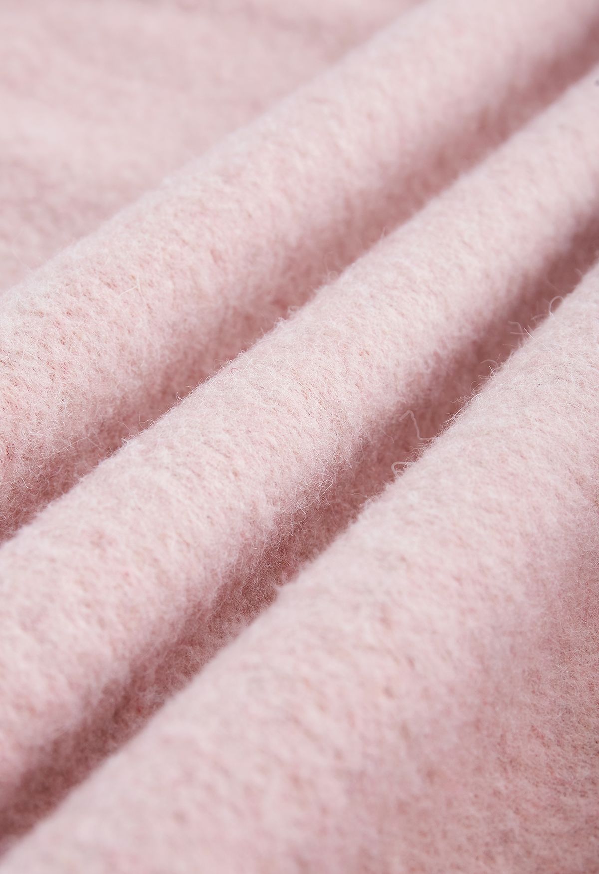 Poncho com capuz de pele sintética com franjas em rosa