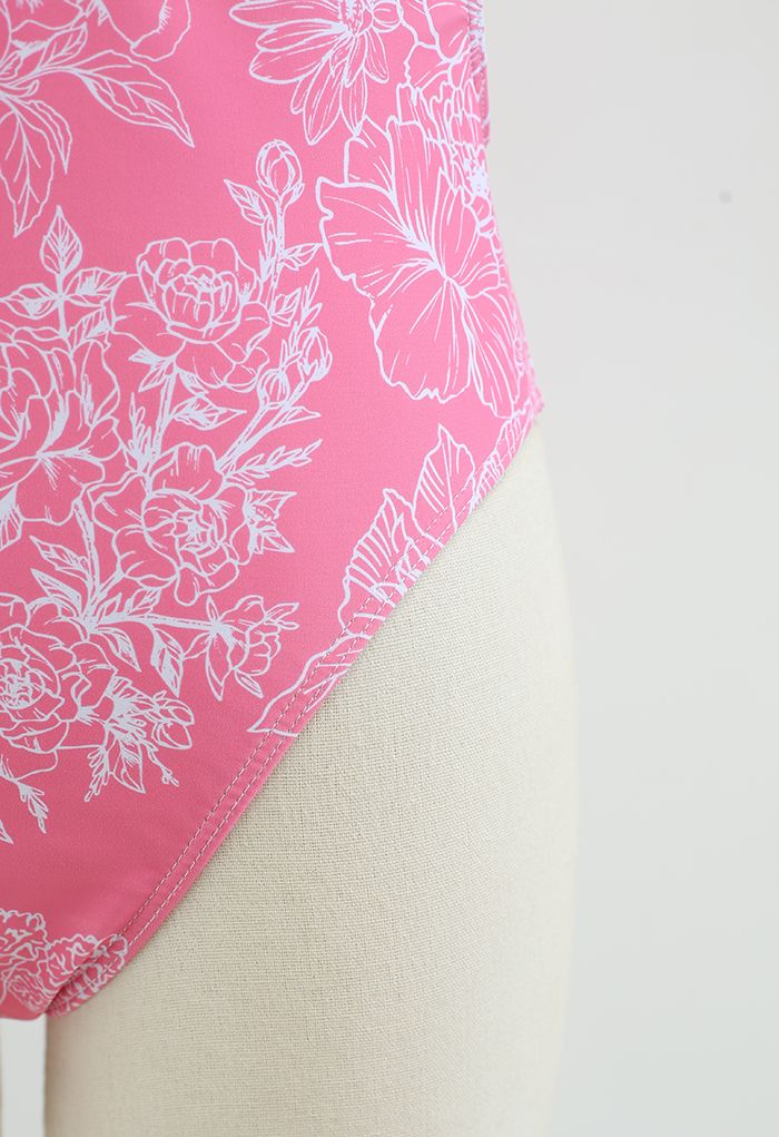 Fato de banho aberto nas costas com desenho floral em rosa