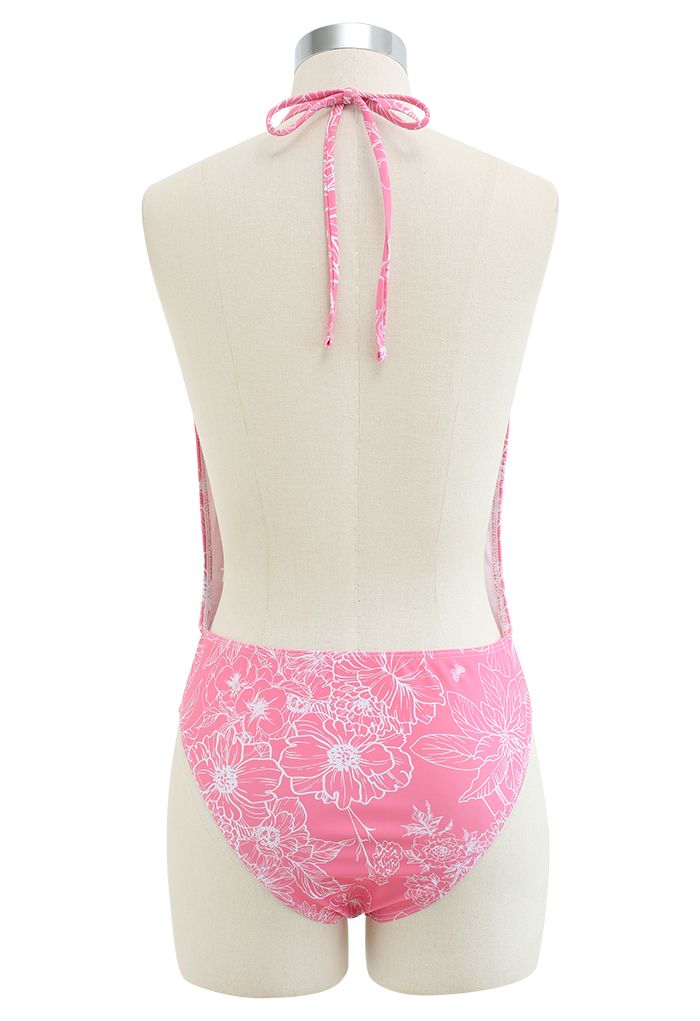 Fato de banho aberto nas costas com desenho floral em rosa