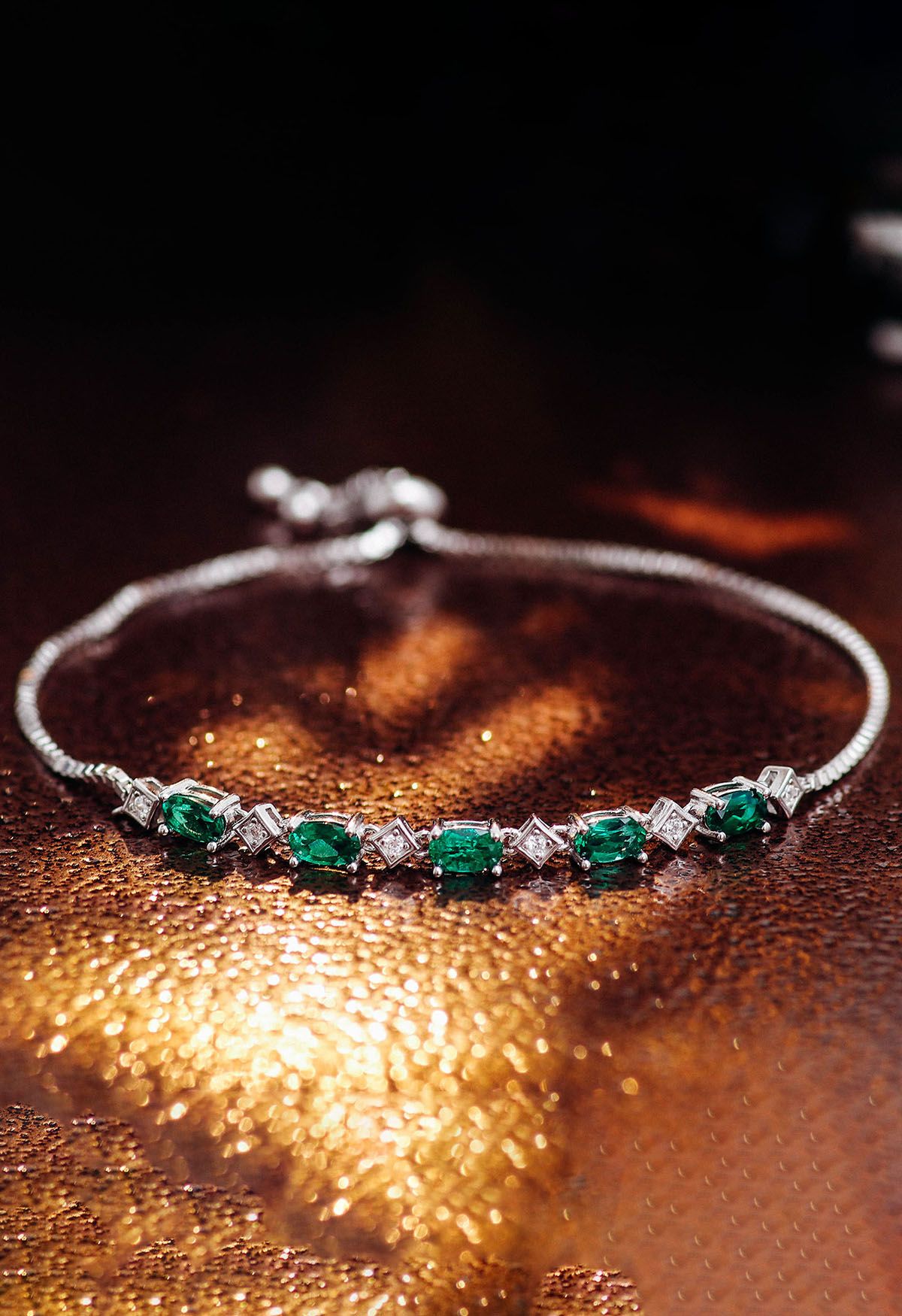 Pulseira de diamante com gema esmeralda formato oval